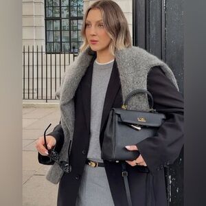 Absolutely stunning rare brand  new purse with handle .A must!